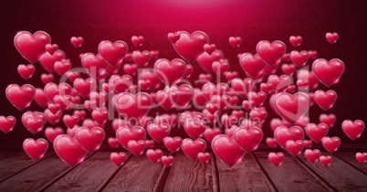 Shiny bubbly Valentines hearts over wooden floor