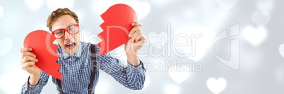 Valentines man breaking heart with love hearts background