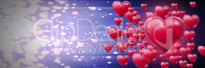 Shiny bubbly Valentines hearts with purple sparkling background