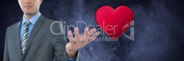 Businessman with open hand and heart