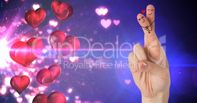 Valentine's fingers love couple and hearts floating from light source