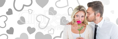 Valentines couple holding rose with love hearts background