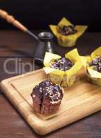 chocolate muffins on a wooden board