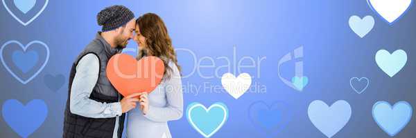 Valentines couple holding heart with love hearts background