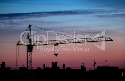 building crane sunset