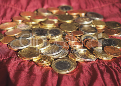 Euro coins, European Union over red velvet background