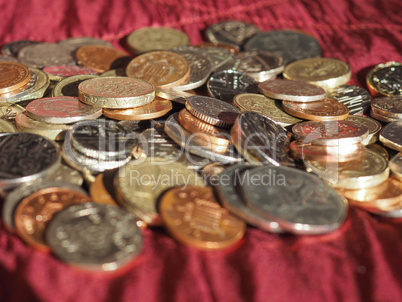 Pound coins, United Kingdom over red velvet background