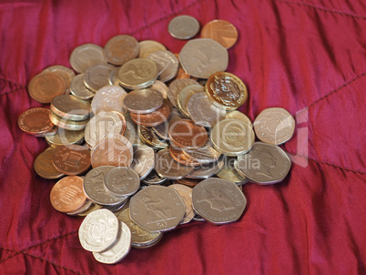 Pound coins, United Kingdom over red velvet background