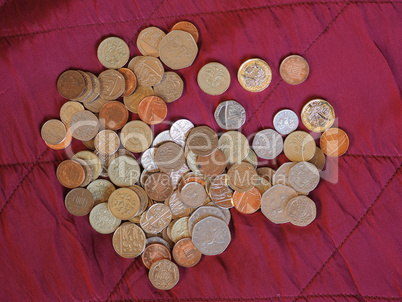 Pound coins, United Kingdom over red velvet background