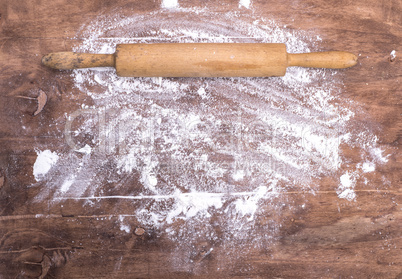 scattered flour on a brown wooden table