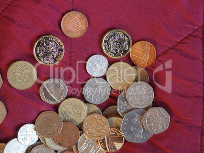 Pound coins, United Kingdom over red velvet background