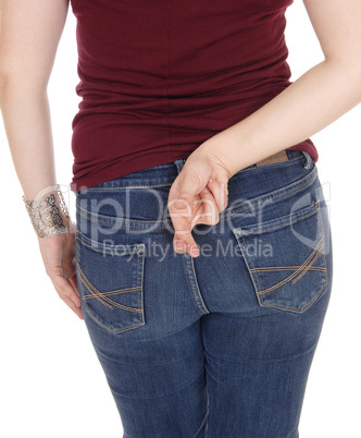 Woman standing from back with crossed finger