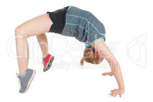 Young slim woman doing gymnastics