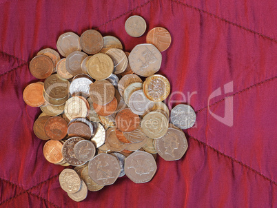 Pound coins, United Kingdom over red velvet background