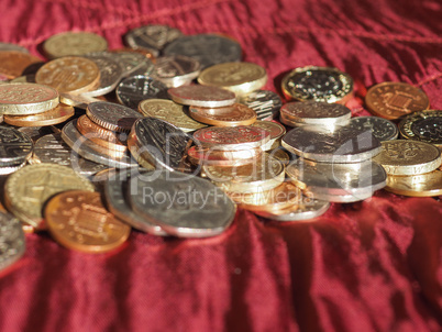 Pound coins, United Kingdom over red velvet background