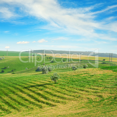 Hilly terrain with a terrace and a blue sky