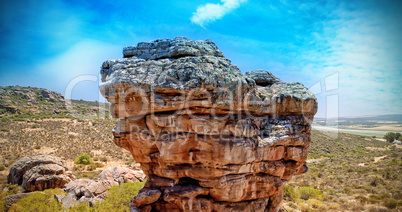 Big rock with landscape behind