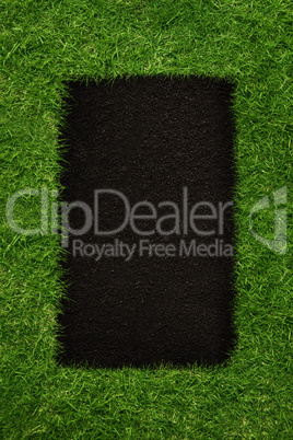 Black square inside green grass