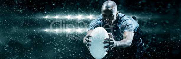 Composite image of rugby player jumping while catching ball