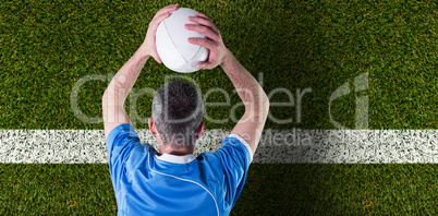 Composite image of rugby player about to throw a rugby ball