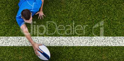 Composite image of rear view of rugby player lying in front with ball