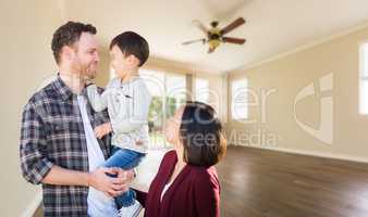 Young Mixed Race Caucasian and Chinese Family Inside Empty Room