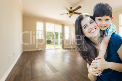 Young Mother and Son Inside Empty Room with Wood Floors.