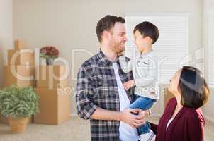 Young Mixed Race Caucasian and Chinese Family Inside Empty Room