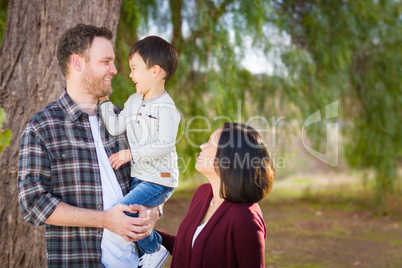 Young Mixed Race Caucasian and Chinese Family Portrait Outdoors.