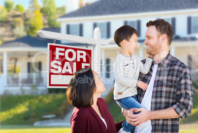 Young Mixed Race Caucasian and Chinese Family In Front of For Sa