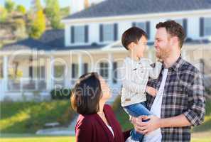 Young Mixed Race Caucasian and Chinese Family In Front of Custom