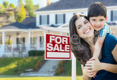 Young Mother and Son In Front of For Sale Real Estate Sign and H
