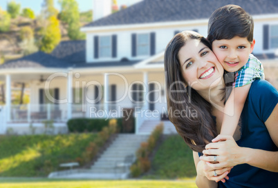 Young Mother and Son In Front Yard of Beautiful Custom House.