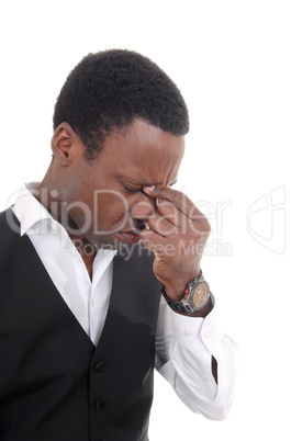 Depressed African man with hand on face