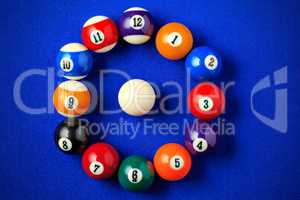 Billiard balls in a blue pool table.