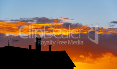 silhouette of residential building at sunset