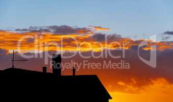 silhouette of residential building at sunset