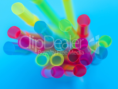 multi-colored plastic tubes for a cocktail