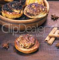baked round buns with poppy seeds and nuts