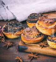 round homemade buns with poppy seeds and nuts