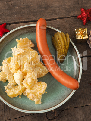 Tasty Christmas food with potato salad