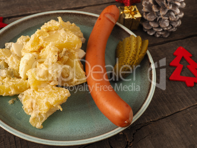 Tasty Christmas food with potato salad