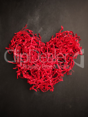 Shredded red paper shaped as a heart shape