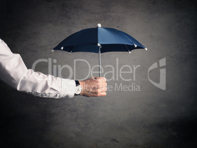 Businessman with an umbrella