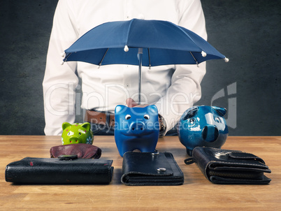 Businessman with a protective umbrella