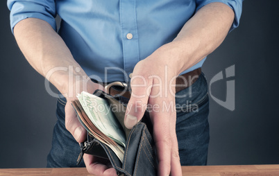 Businessman with an open wallet