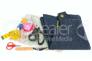 Sewing accessories and paper pattern isolated on white backgroun