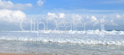 Sandy beach and blue sky. Wide photo.