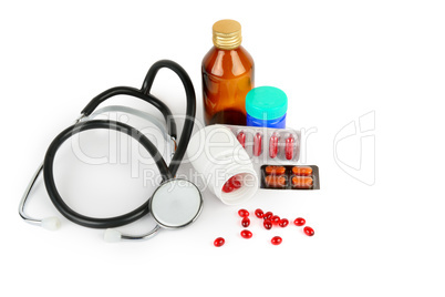 Stethoscope, pills and medical preparations isolated on white ba