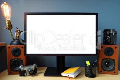 Mock-up. Monitor on an office desk with vintage lamp and photo c